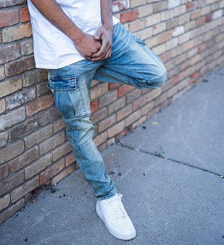 man wearing a white shirt and jeans
