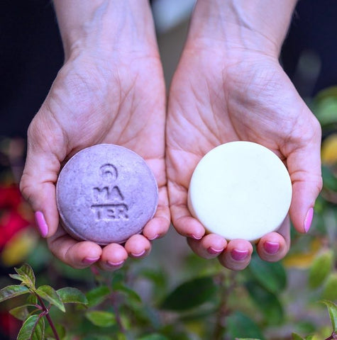 MATER shampoo and conditioner bars in hands