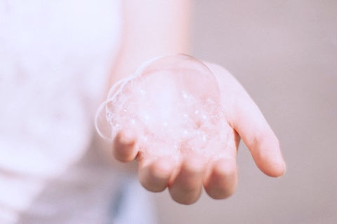 Hand holding big bubbles