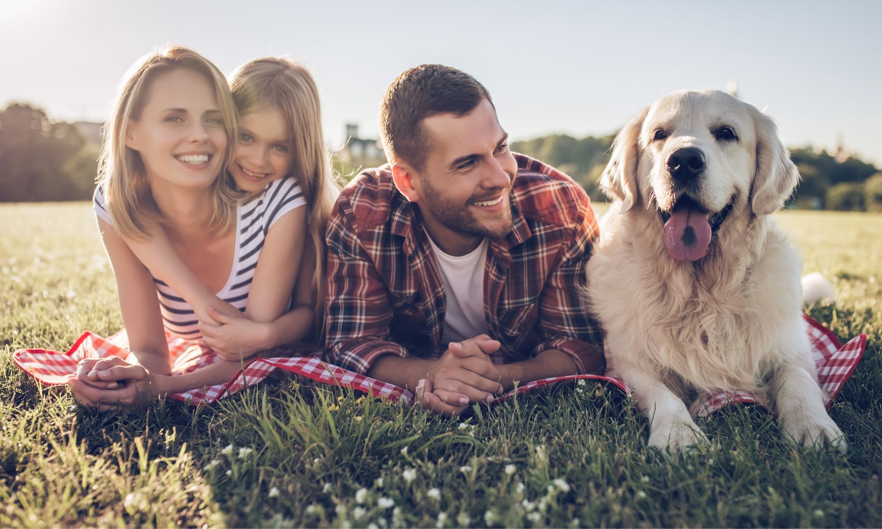 Happy family with their happy dog