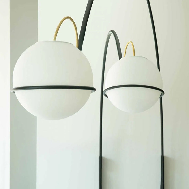 Fontana Arte Alicanto wall lamp refined black structure, gold detail and white glass
