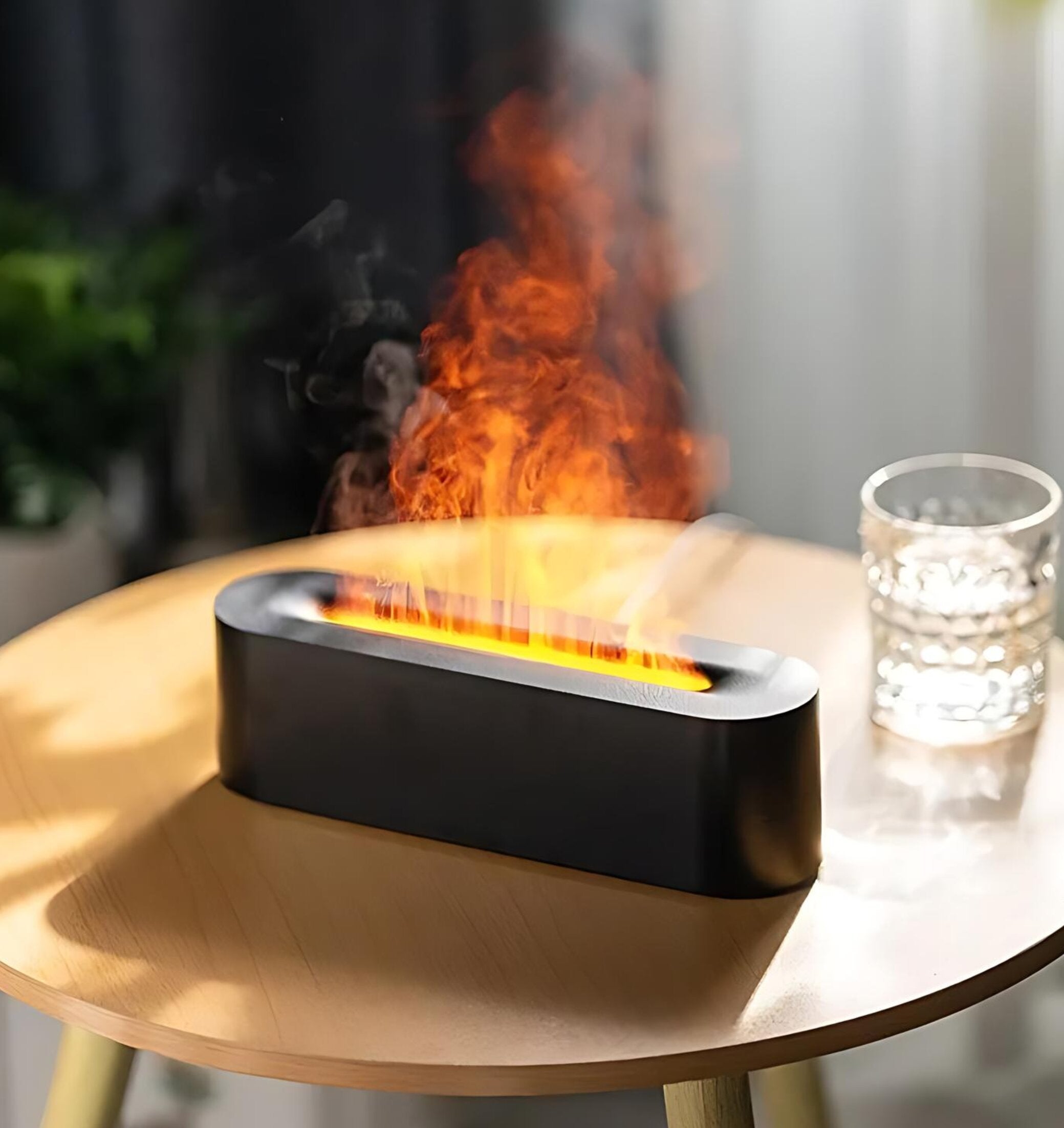 Stylish flame aroma diffuser on the table.