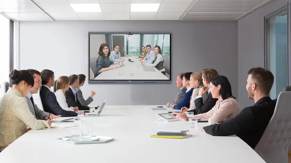 Business team using smart board in a sleek conference room for presentation and collaboration