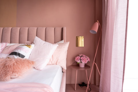 cozy-pink-bedroom-corner-with-baby-pink-velvet-fabric-bed-decorated-by-blanket-pillows-pink-floor-lamp-with-two-tone-pink-painted-wall