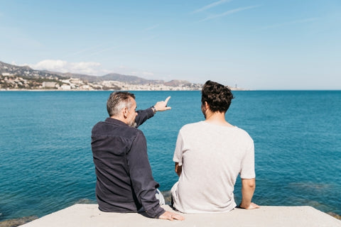 fathers-day-concept-with-father-son-looking-towards-sea