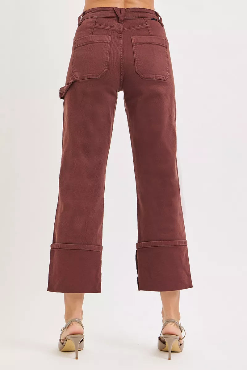 High rise wide straight jeans side view showing cuffed hem details and plus size tailoring