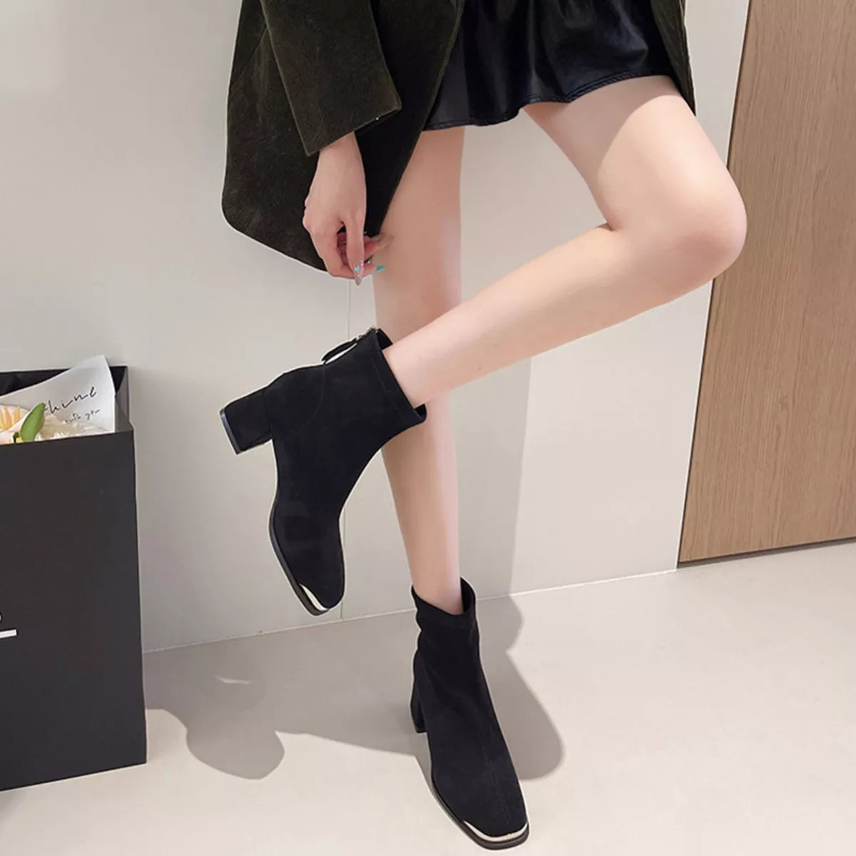 Black square toe boots showing modern silhouette - detailed close-up