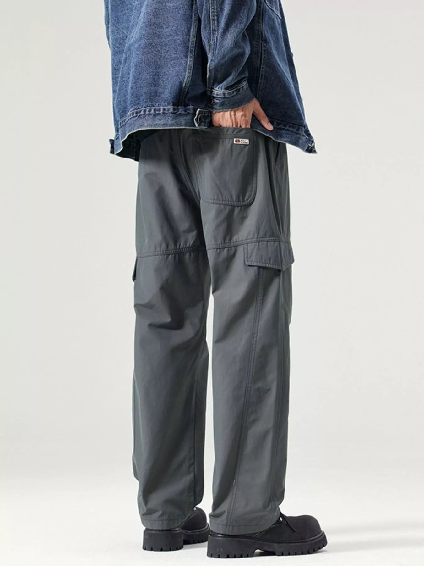 Wide leg cargo pants detail view showing quality construction and multiple pocket functionality