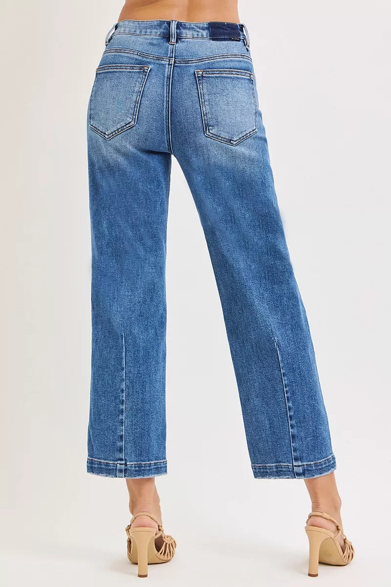 High rise crop boyfriend jeans side view showing tapered leg design and flattering silhouette