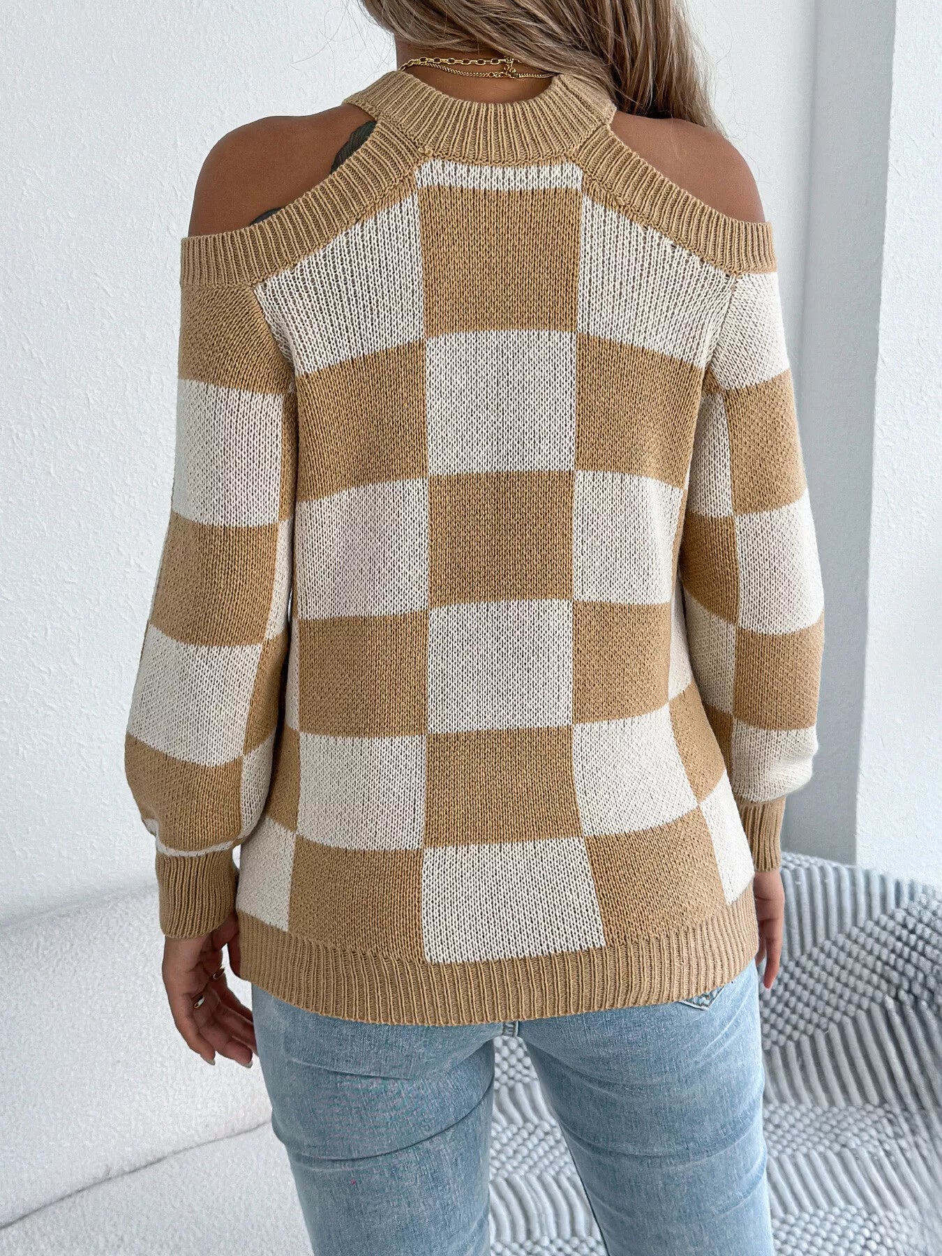 Trendy checkered sweater side view showing cold shoulder cutout details and comfortable fit