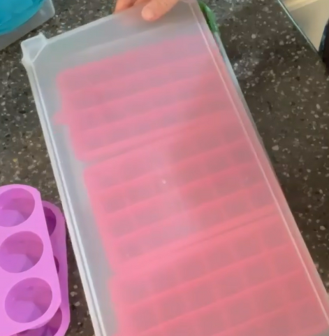 Lid being set on top of stackers to add a second layer to freeze on top of