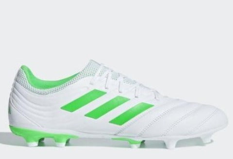 white and green adidas cleats