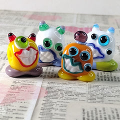 Collection of little monster lampwork beads