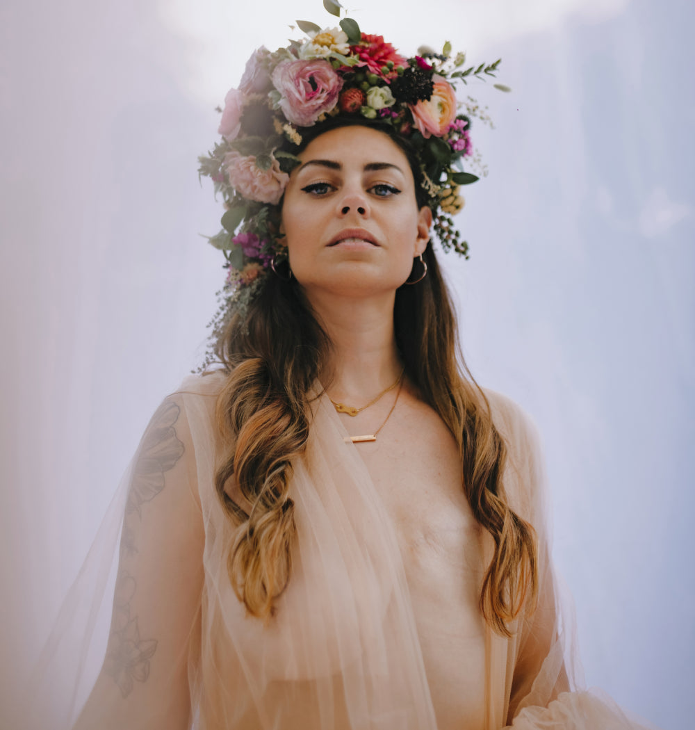 Two years post-surgery, taken by @daniellearnoldphotography. Floral headband by Krystal at @snowberrybotanicals. display: full
