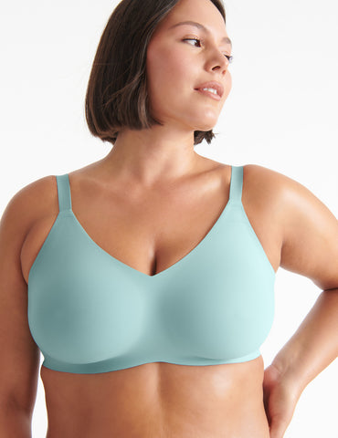 Woman wearing wireless bra with wide straps.