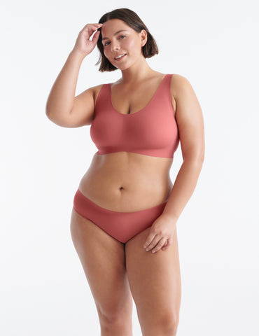 Woman wearing leakproof underwear and wireless bra.