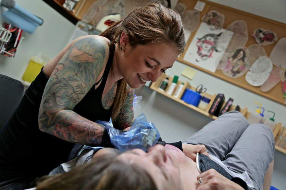 One of many tattoo artists who volunteer their time and talent to provide free mastectomy tattoos/Meaghan Goeb  display: full