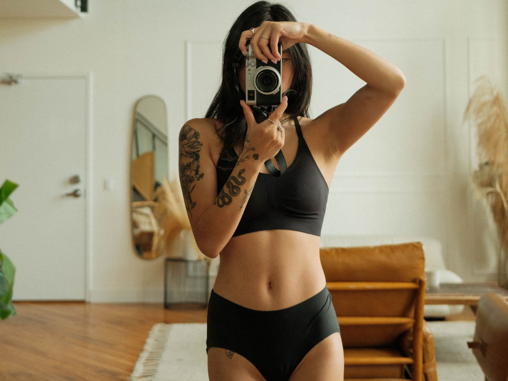 Photographer Jasmin Chew in the Knixy Lace Racerback Bralette and Essential Boyshort display: full