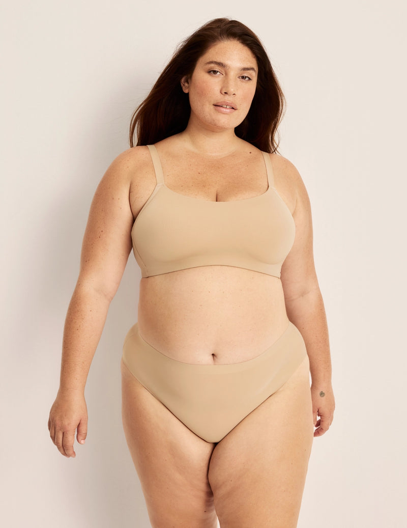 Clementine has 51” hips, and wearing KNIX XXL
