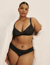 Leslie has 49” hips, wearing KNIX XXL
