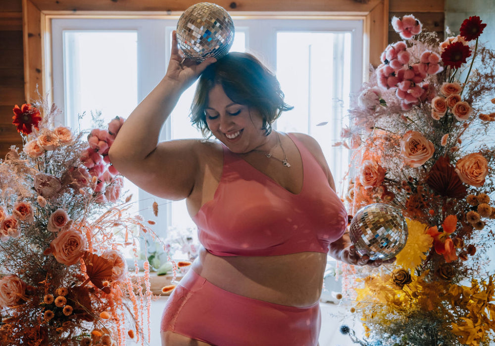 Kayla Logan wearing the Revolution Bra and Lace Essential High Rise in Pink Plum (Image by: @youbymia Florals by: @unfazedfloral and @sweetstemsfloral) display: full