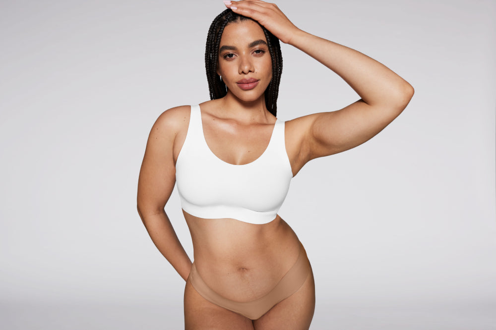 Knix model wearing the Revolution Adjustable Pullover Bra in White display: full