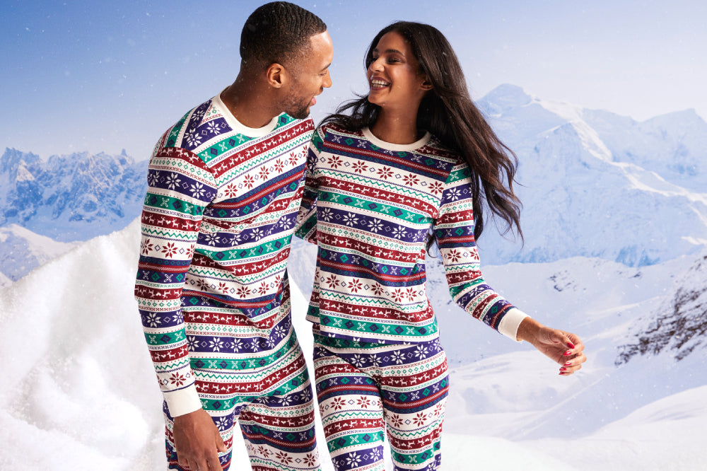 A couple getting matchy in the Knix Matchy-Matchy Pajamas Set display: full
