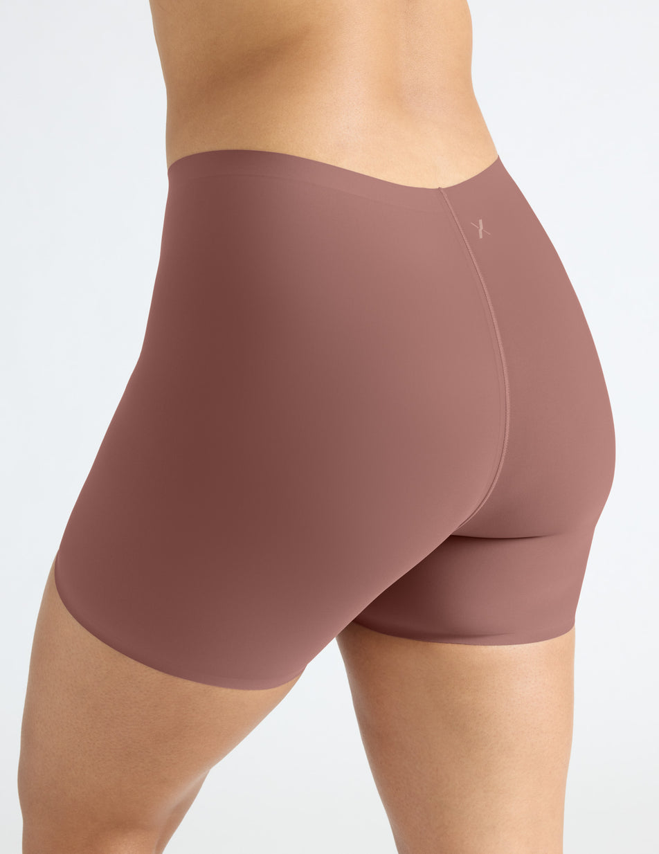 Alicia has 44" hips and is wearing a Knix Thigh Saver 4" size L