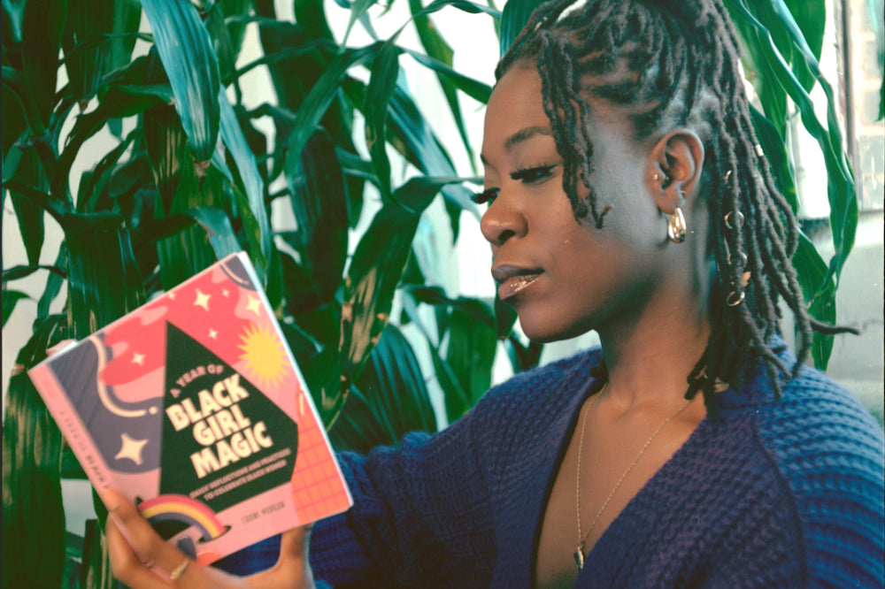 Author Eboni Morgan and her debut book, A Year of Black Girl Magic display: full