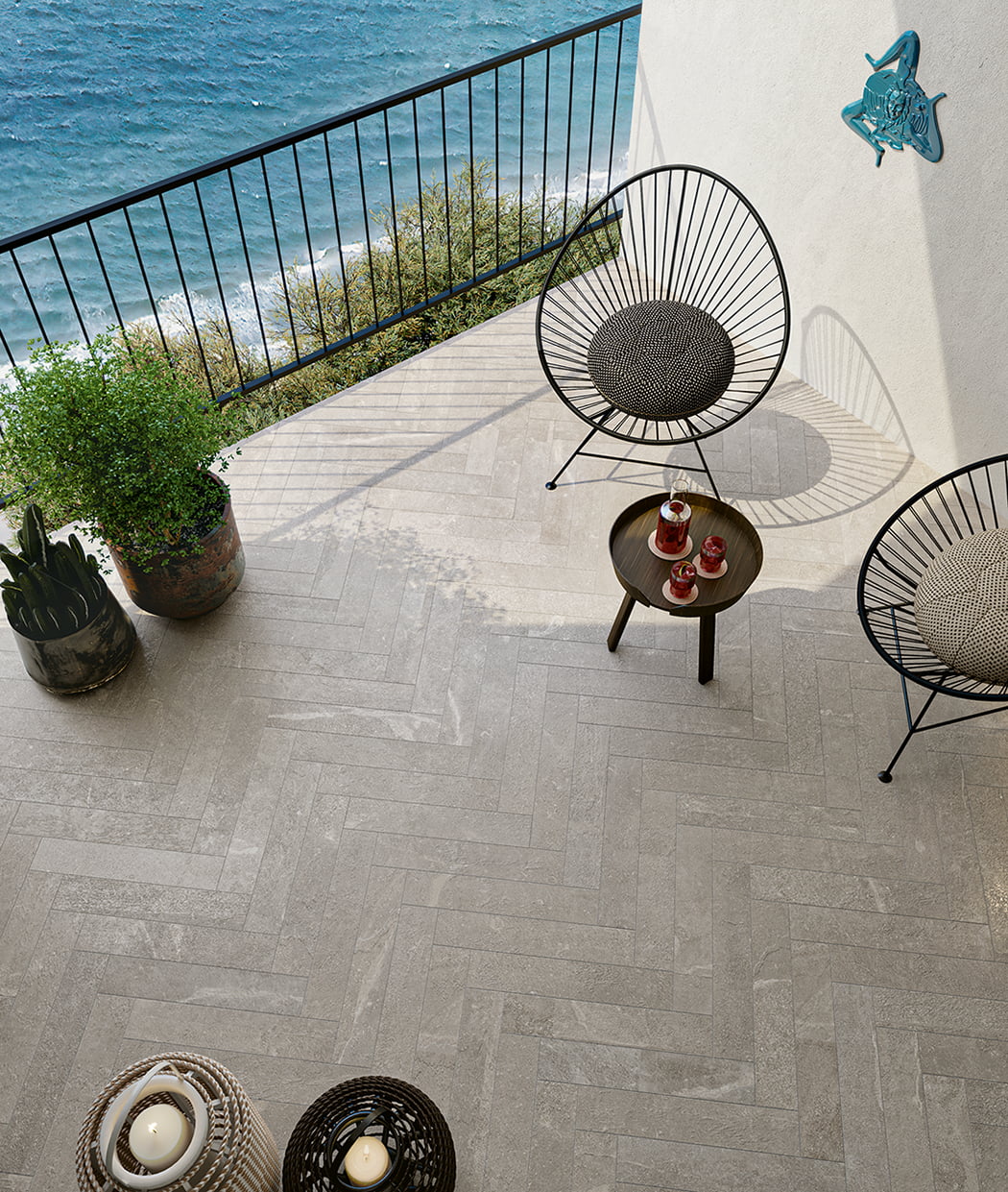 Ibla 4x20 Chevron Porcelain Tile in Resina featured on a balcony