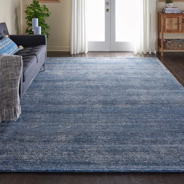 Weston Area Rug in Aegean Blue in traditional livingroom