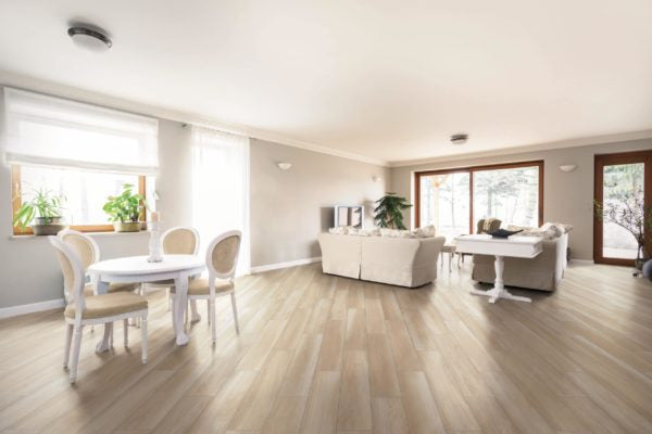 Natural 6x36 Porcelain Wood Plank Tile in Noce Chiaro featured in modern minimalist living room