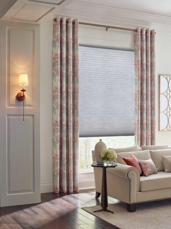 Hunter Douglas Duette® Honeycomb Shades in an airy living room 