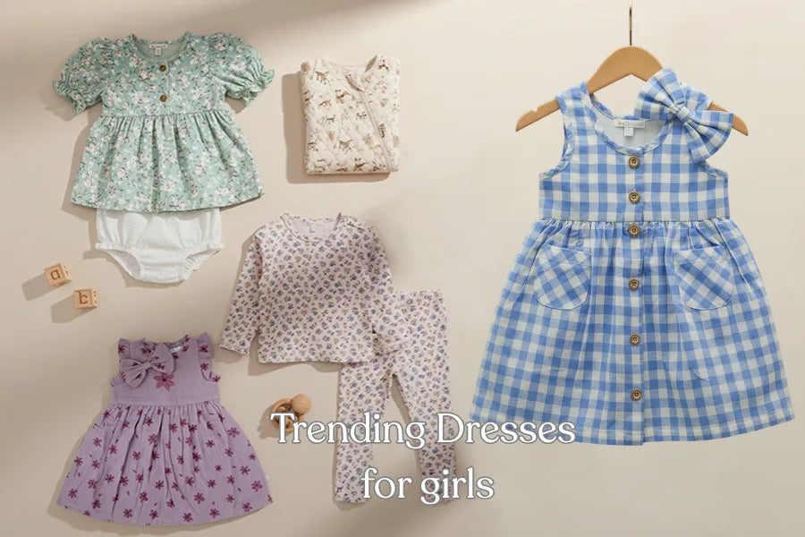 Trending kids dresses for girls flatlay featuring floral frocks, co-ord sets, and organic cotton outfits arranged on a soft beige background.