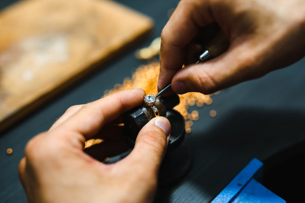 craftsman working on a diamond ring