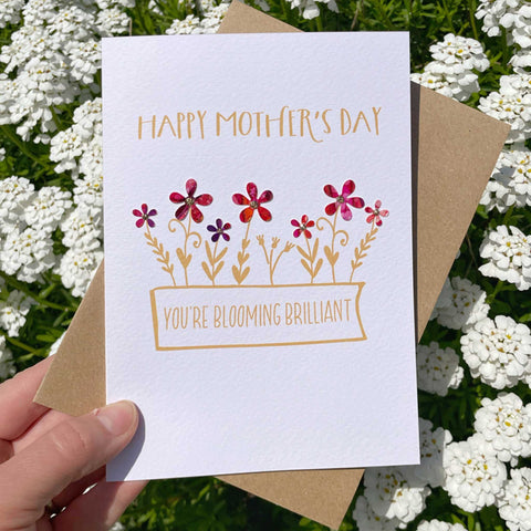 Mothers Day Greeting Card with a flower box saying Blooming Brilliant with colourful flowers growing