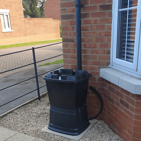 Bottom water container stacked on top of matching water butt stand