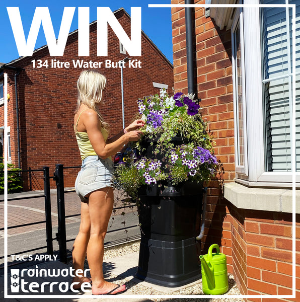 Win a water butt competition picture with girl stood by a 134 litre rainwater terrace water butt planter