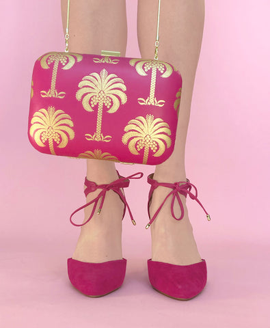 Hot pink nappa clutch bag with gold foil palm tree print