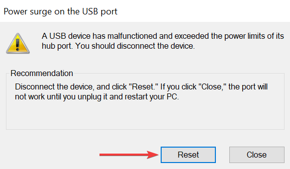 When you receive a power surge warning on the USB port, disconnect all devices connected to the computer and click the reset button.  After the reset process is complete, restart your computer for the changes to take effect.