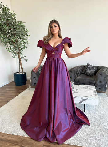 A woman in a long purple dress