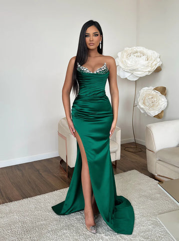 A woman in a long green dress