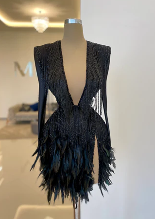 A sort black dress with feathers