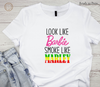 White shirt with 'Look like Barbie, Smoke like Marley' DTF transfer design