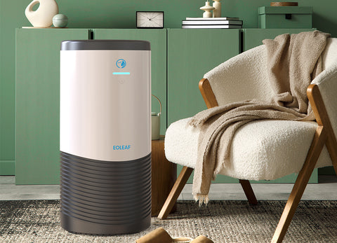Eoleaf's AERO PRO 100 air purifier next to a chair in a living room