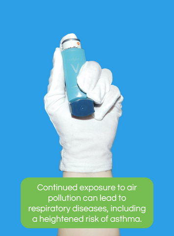 Medical professional wearing a glove holding an inhaler