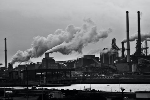 An industrial site with smokestacks producing air pollution