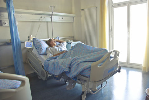 A woman in a hospital bed