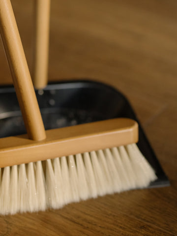A dustpan and a broom