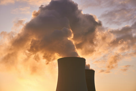 Smoke billowing out of an industrial smokestack